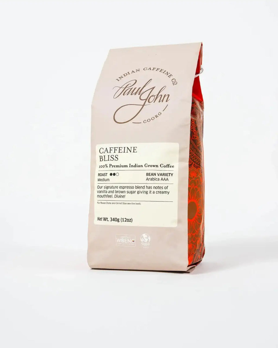 A bag of Paul John Caffroo Indian Caffeine Bluss coffee on a clean white background.